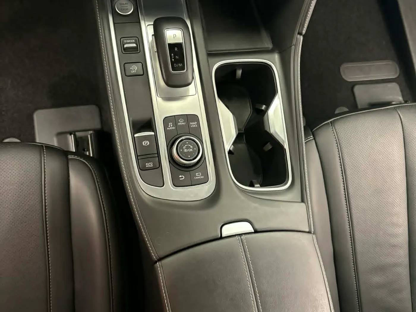 Clean center console and shifter area after a steam clean and dash detail, cup holders and controls spotless